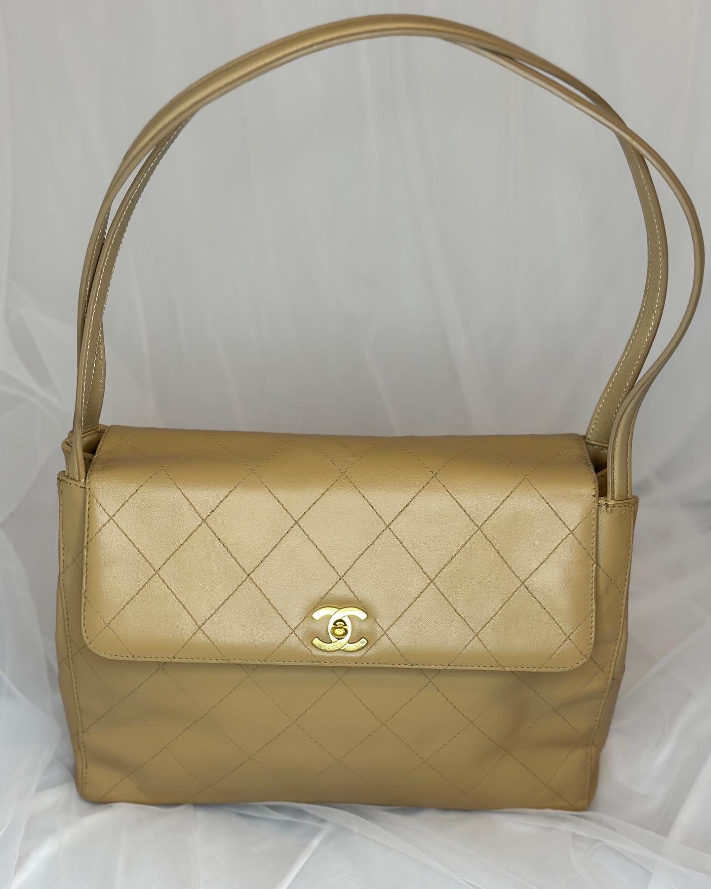 Chanel beige lambskin half flap bag