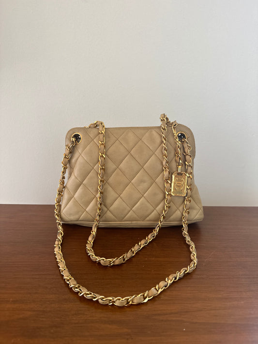 Chanel beige shoulder bag with gold hardware and tag