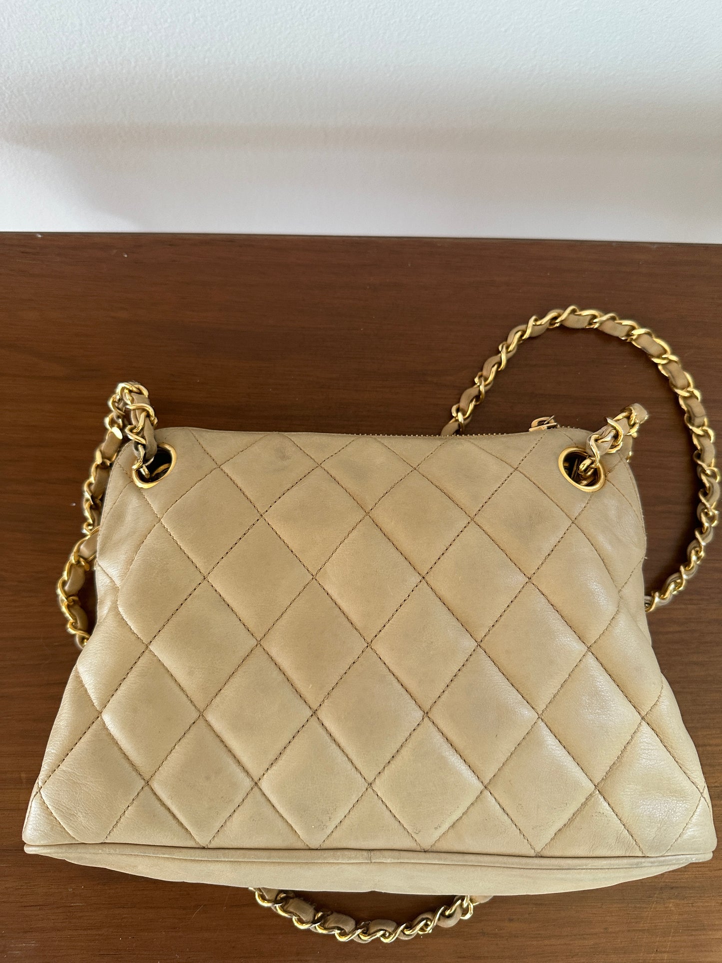 Chanel beige shoulder bag with gold hardware and tag