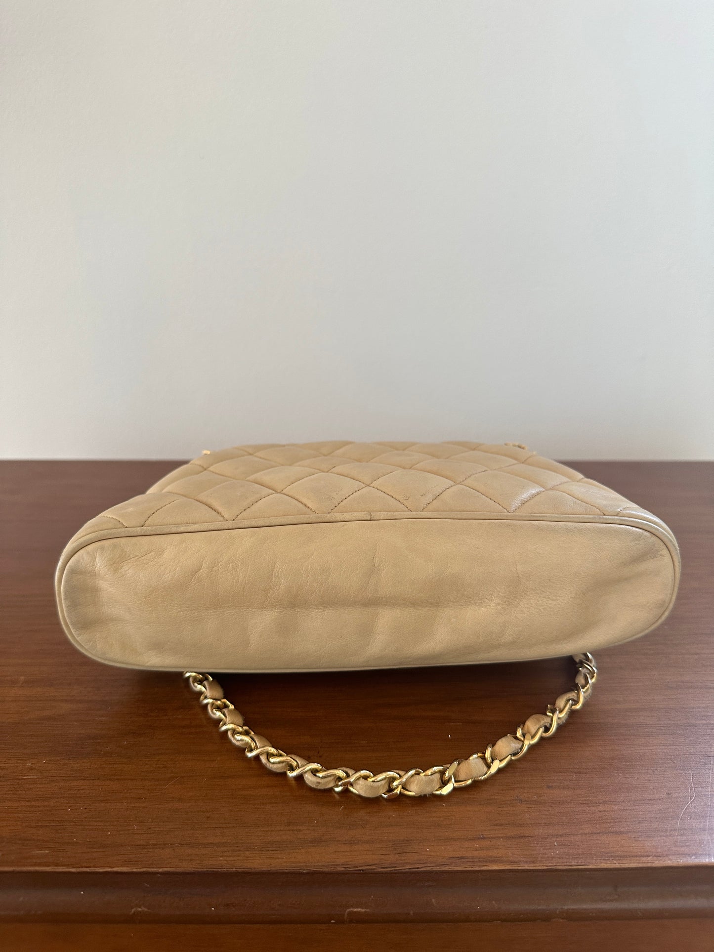 Chanel beige shoulder bag with gold hardware and tag