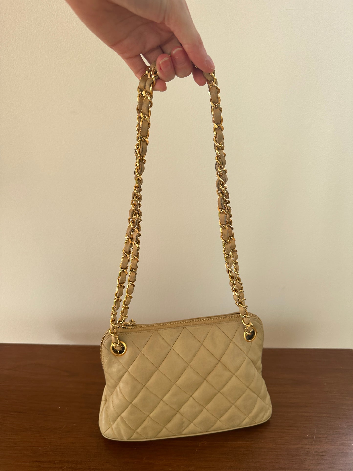 Chanel beige shoulder bag with gold hardware and tag